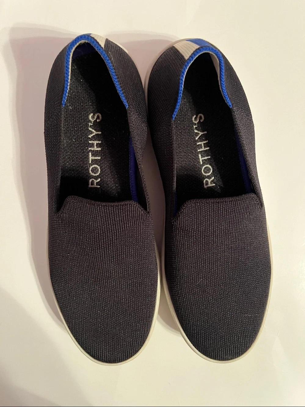 Rothy's Women’s Black Slip-On Sneakers Size 8 with Blue & White Stripe Accent